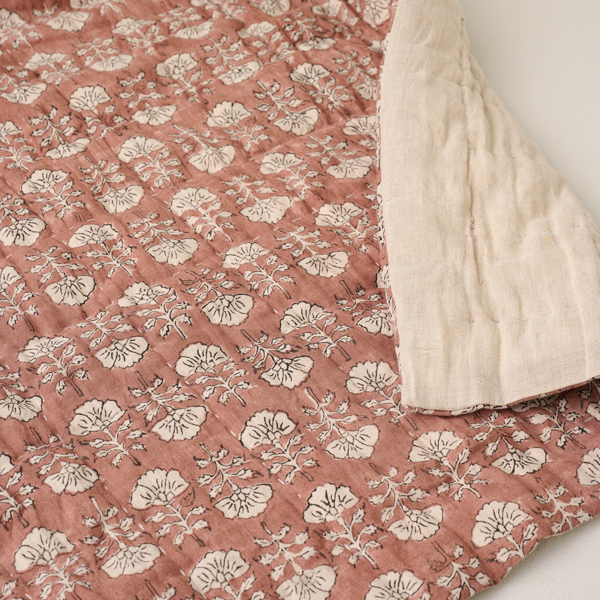 Top view of Flora Block Desert Clay Print Quilt