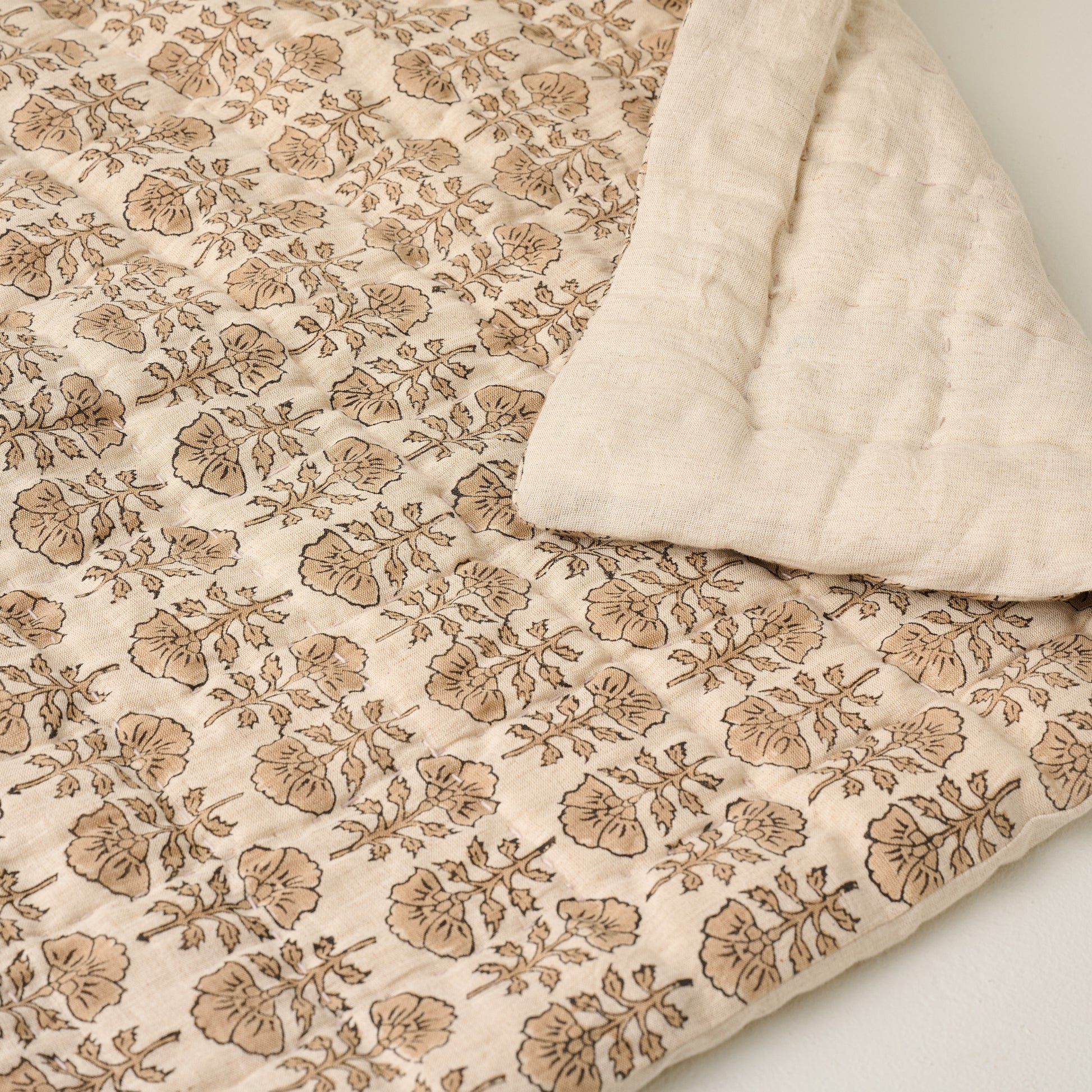 Top view of Flora Block Natural Print Quilt