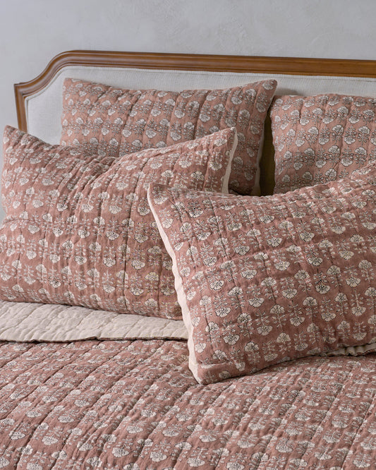 Flora Block Print Pillow Sham - Desert Clay shown on bed