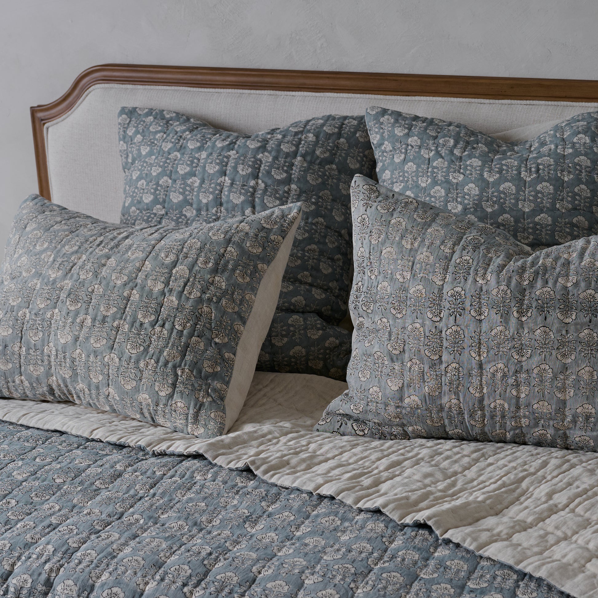 Flora Block Print Pillow Sham - Silver Blue shown on bed