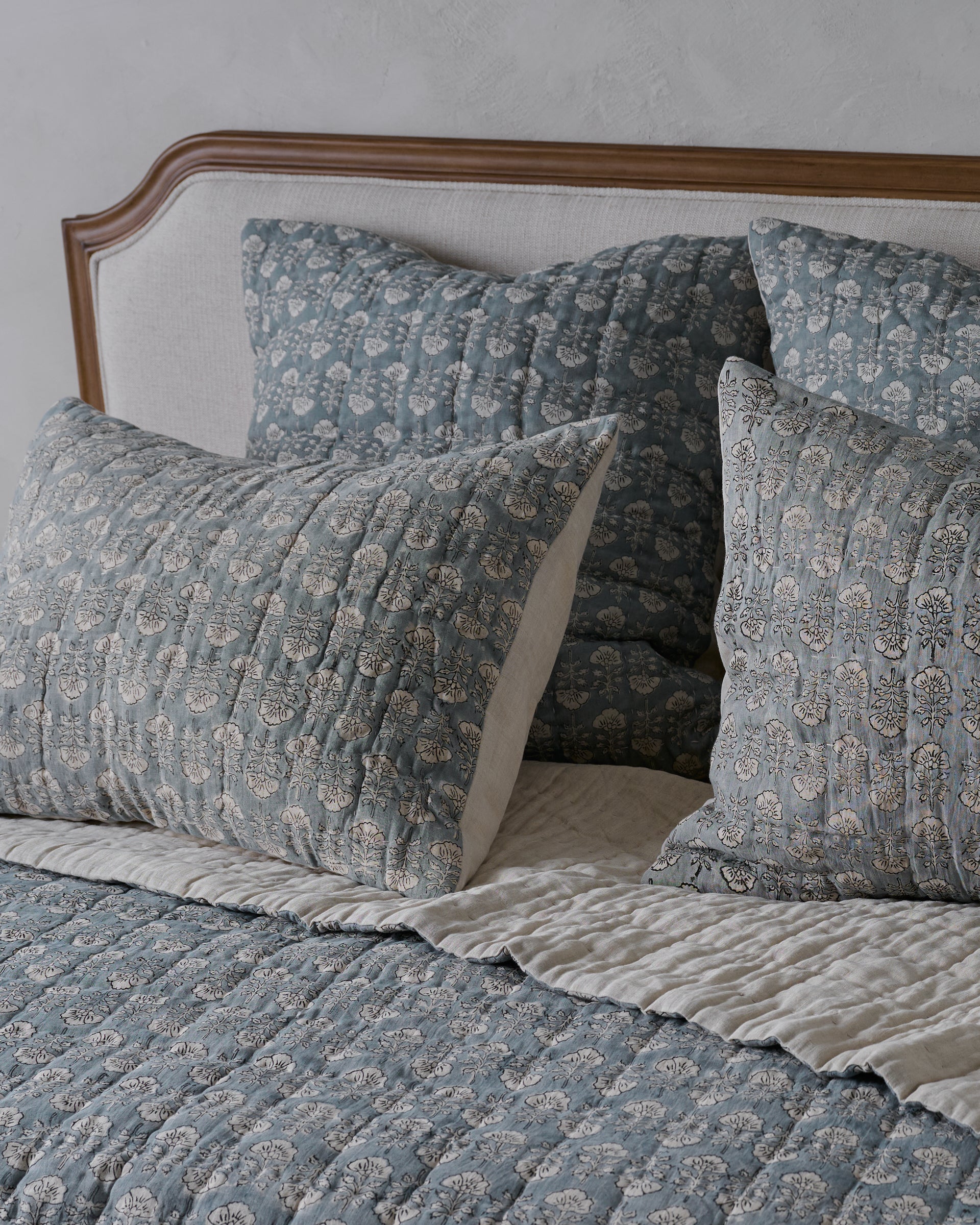 Flora Block Print Pillow Sham - Silver Blue shown on bed