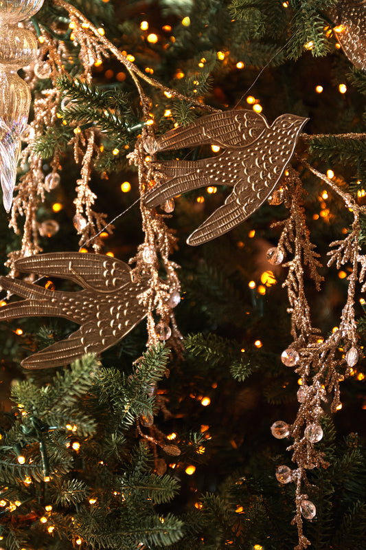 Pressed Metal Dove Garland, 72" on a tree