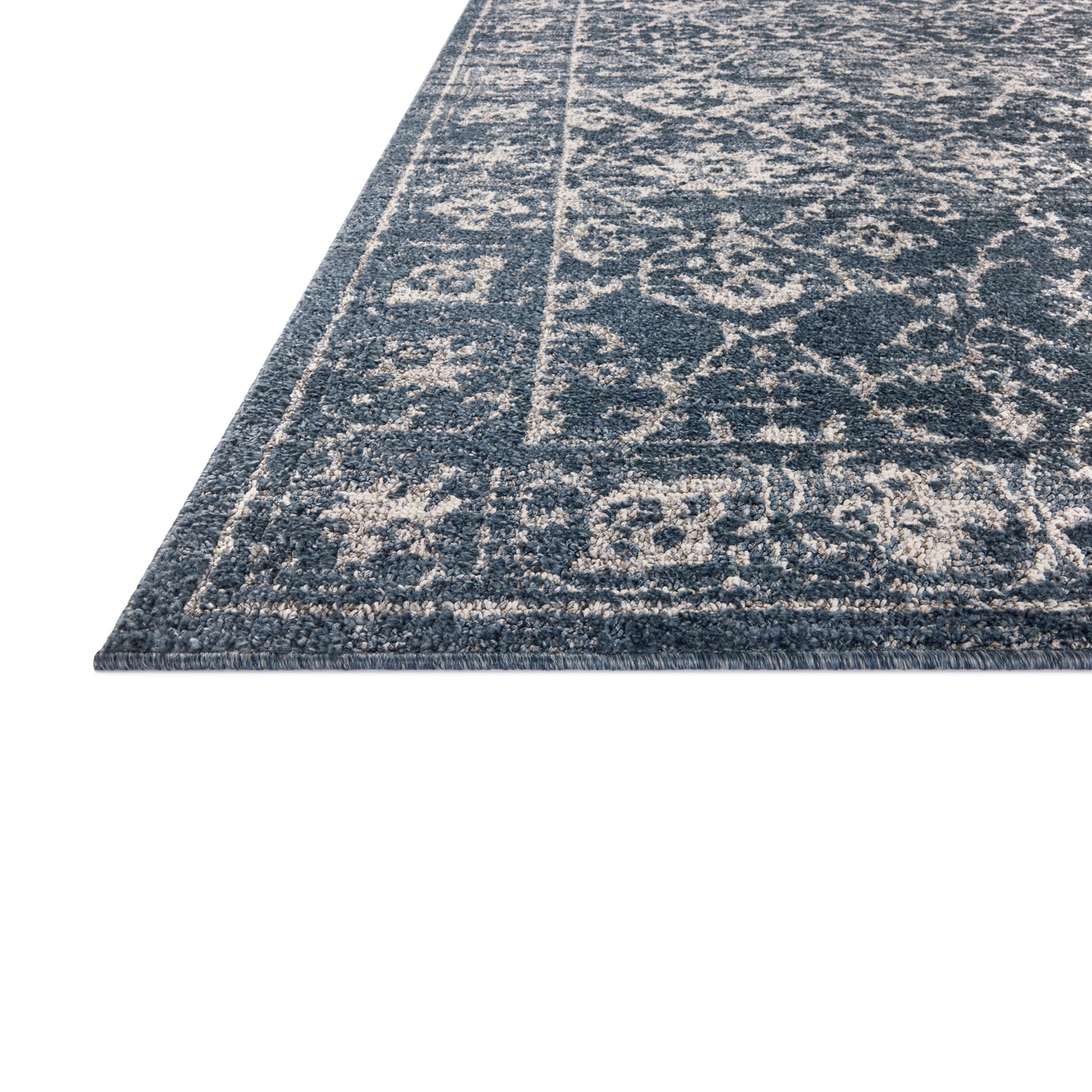 Gigi Navy Stone Rug close up of corner