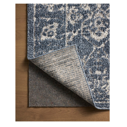 Gigi Navy Stone Rug close up of corner flipped back