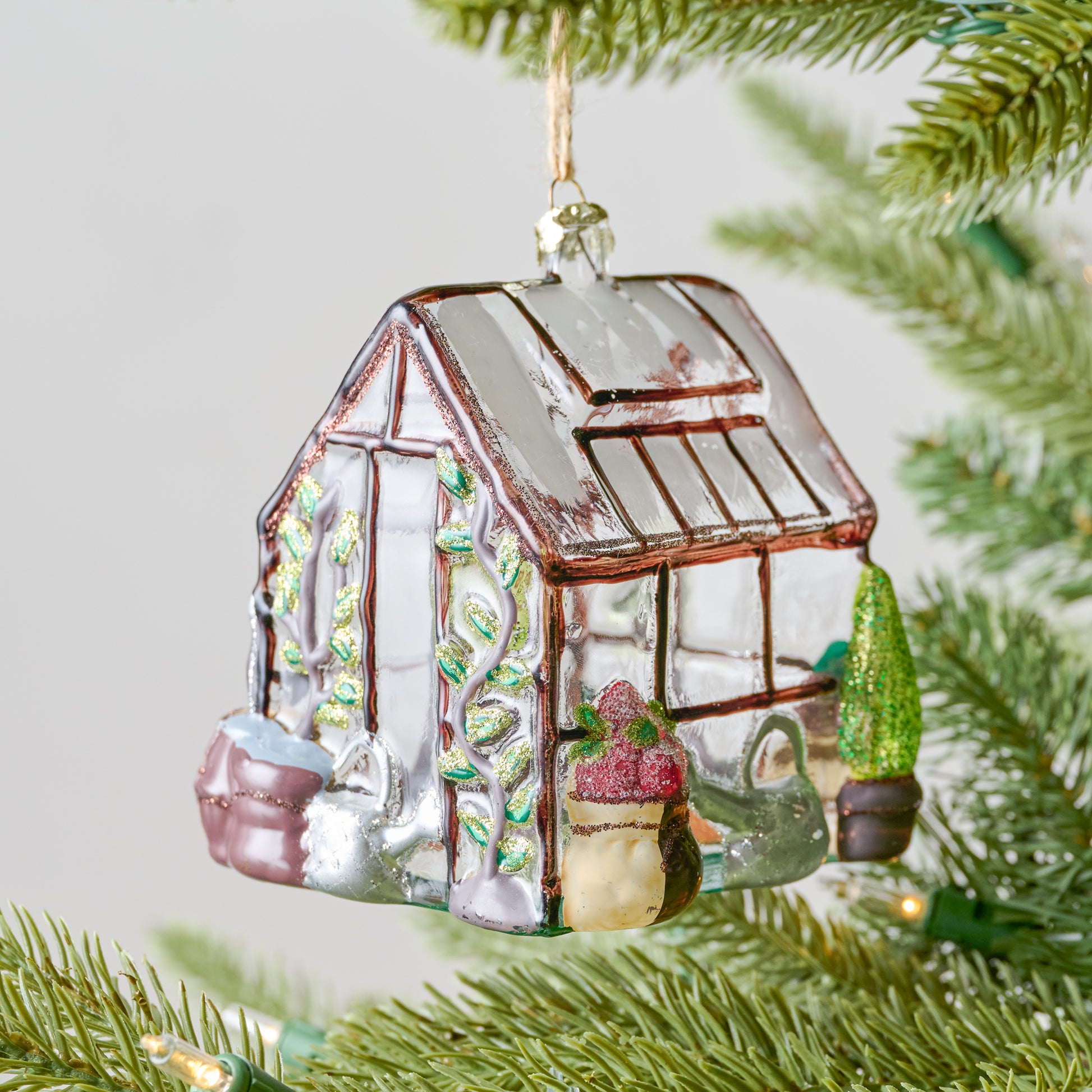 Greenhouse Ornament shown on tree