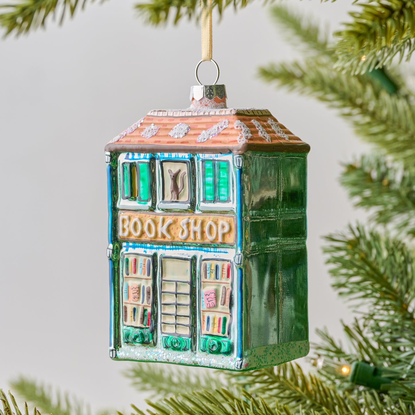 Bookshop Ornament shown on tree