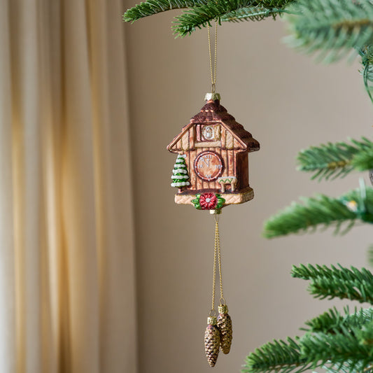 Vintage Cuckoo Clock Ornament shown hung from tree