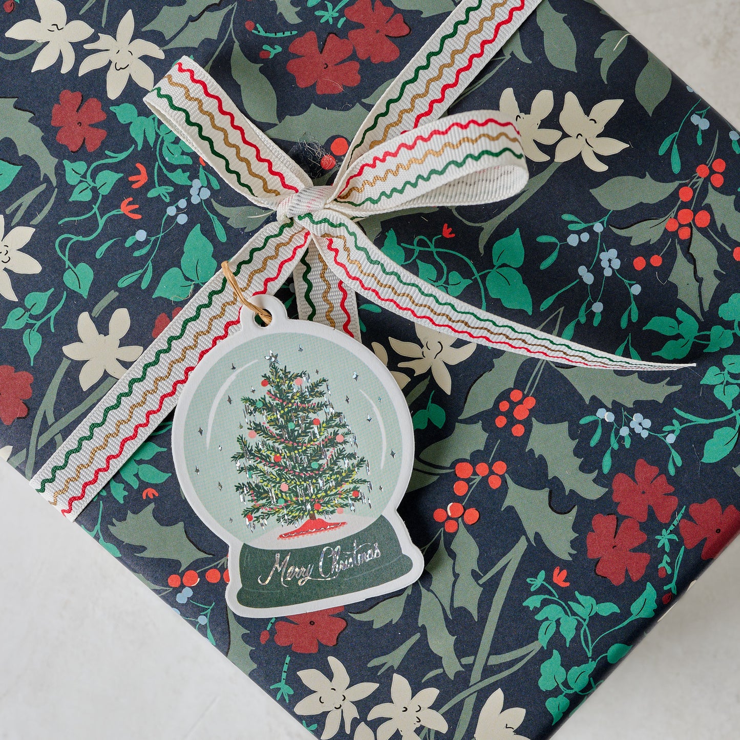 Snow Globe Gift Tag shown on gift