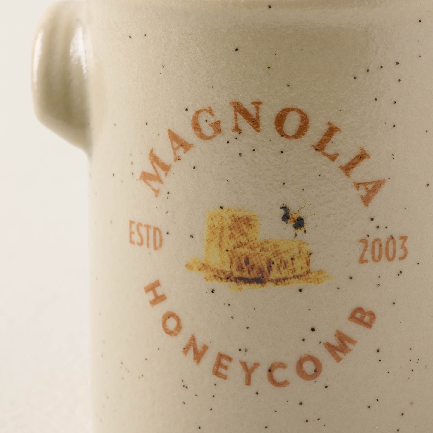 close up view of honeycomb candle label