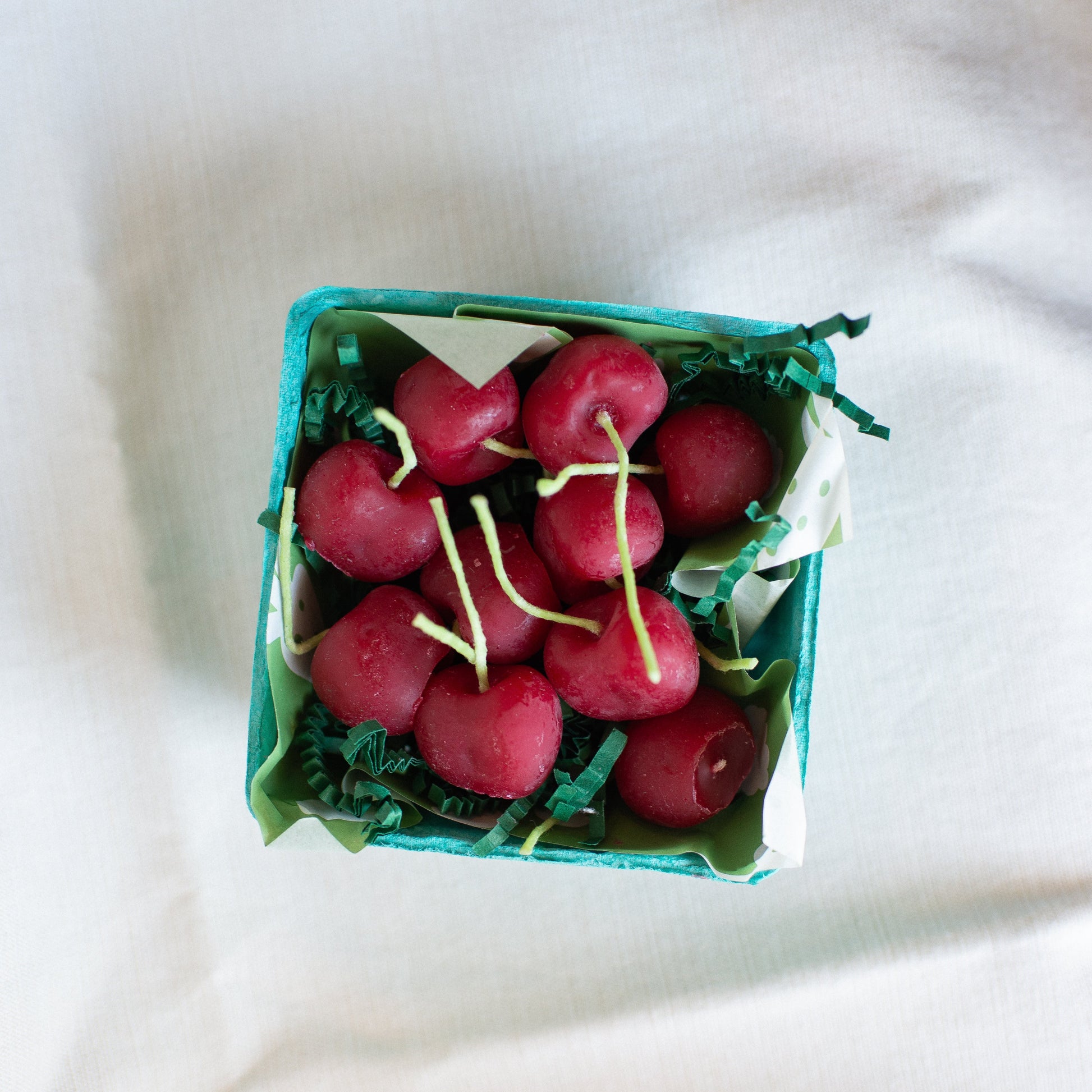 Cherry Birthday Candle Set of 10 shown in carton