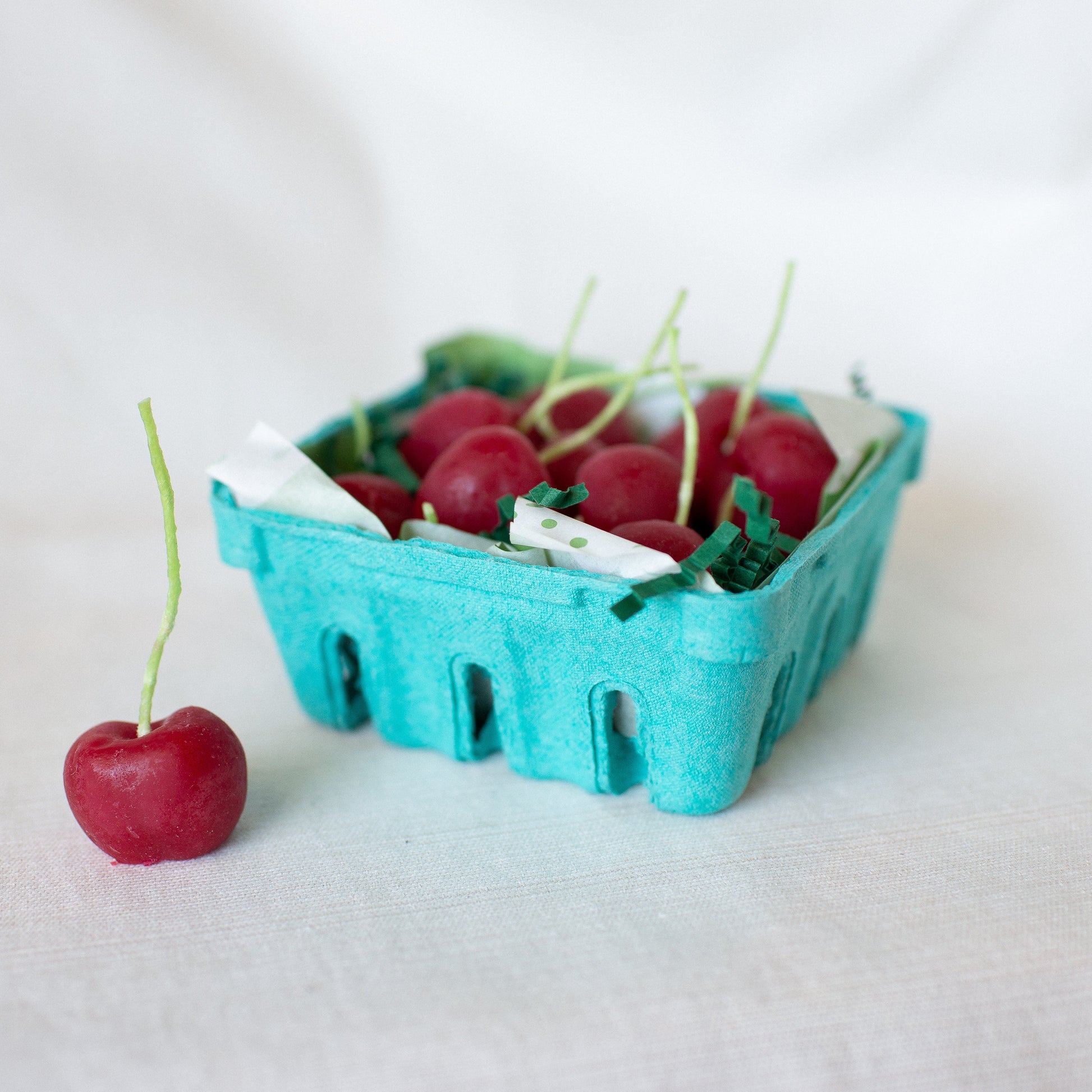 Cherry Birthday Candle Set of 10 shown in carton