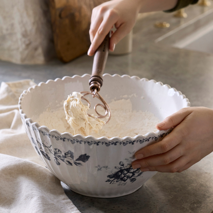 Heirloom Floral Large Mix + Serve Bowl mixing dough with whisk in hand
