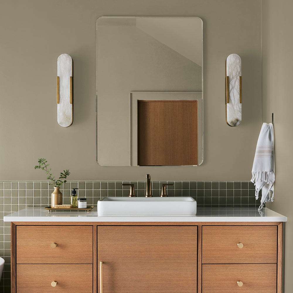 sunwashed green paint color named juniper tree shown painted on bathroom wall