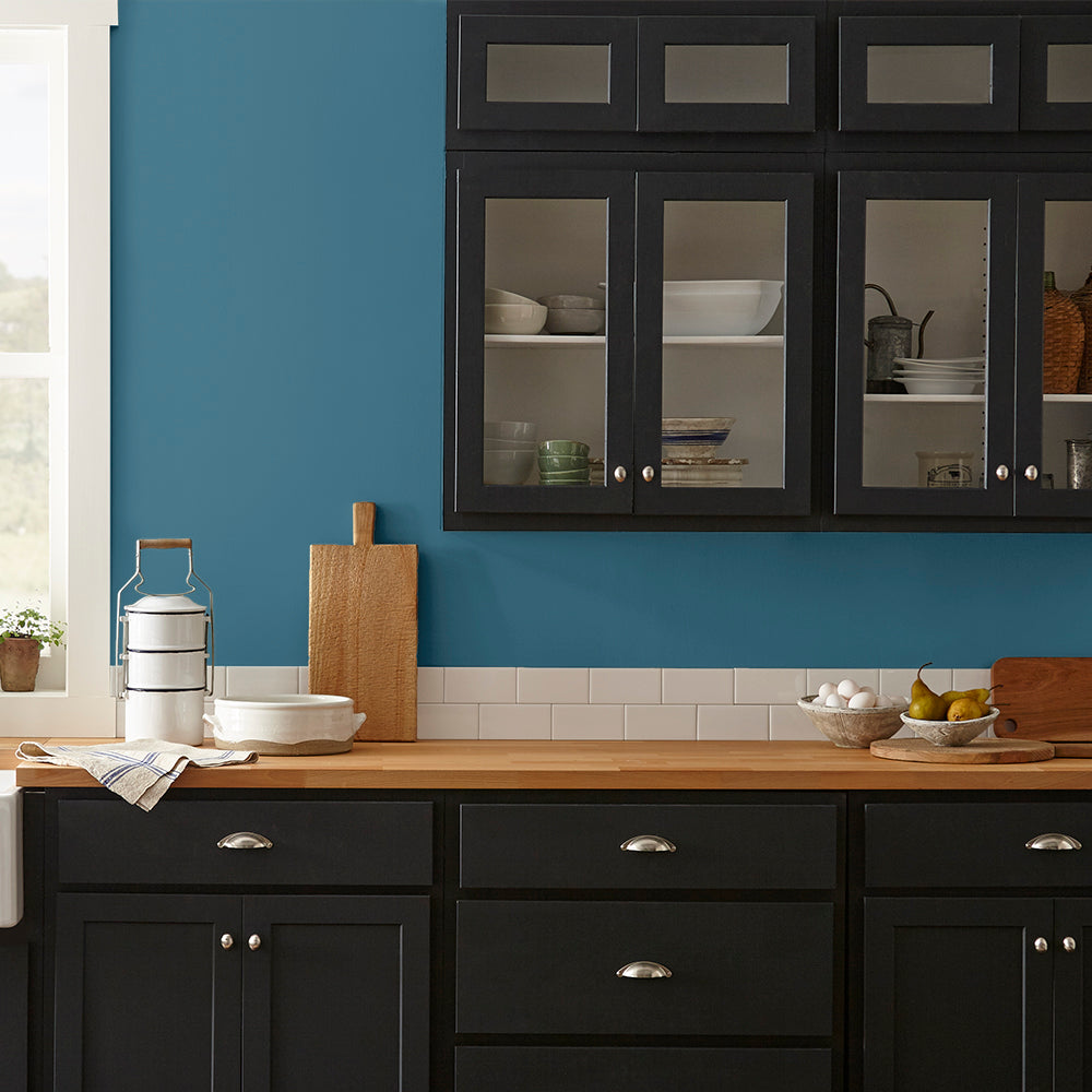 true blue paint color named superior shown painted on kitchen wall