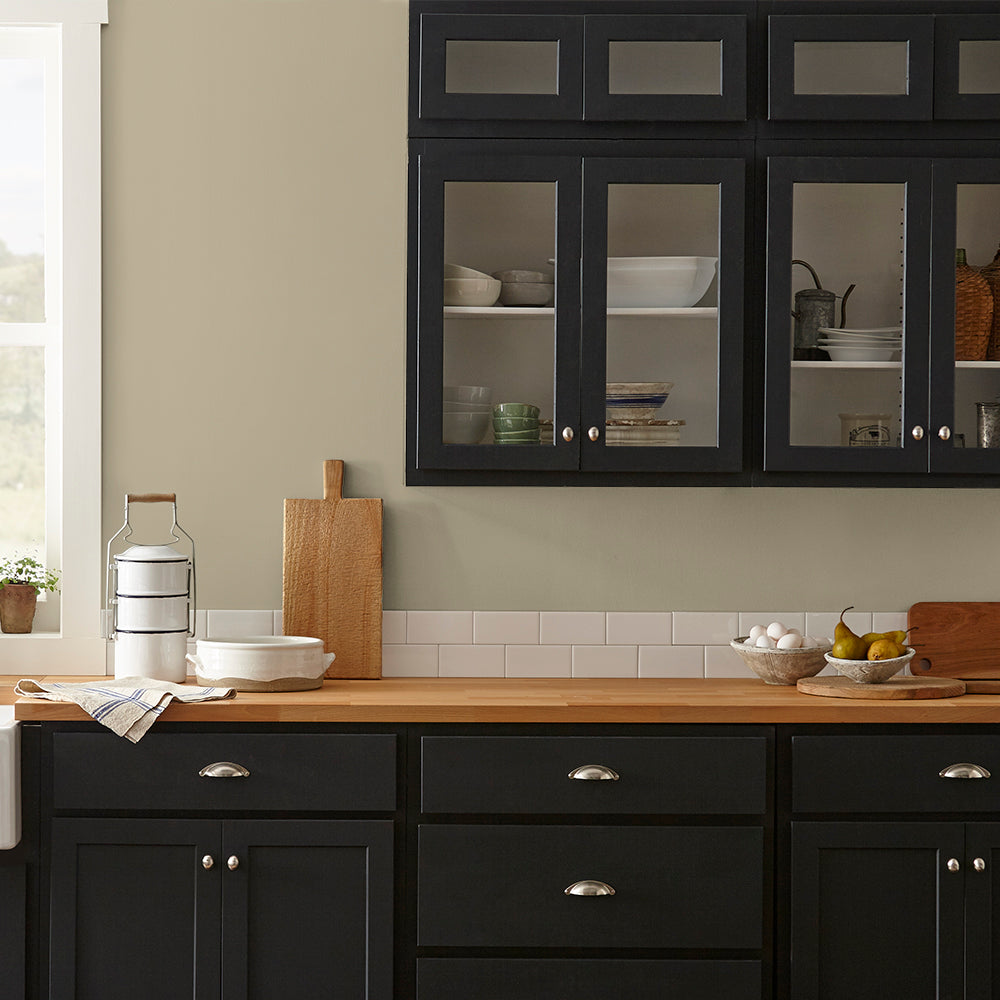 sunwashed green paint color named juniper tree shown painted on kitchen wall