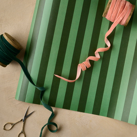 Magnolia Green Stripes Wrapping Paper Sheets with a spool of pink velvet ribbon