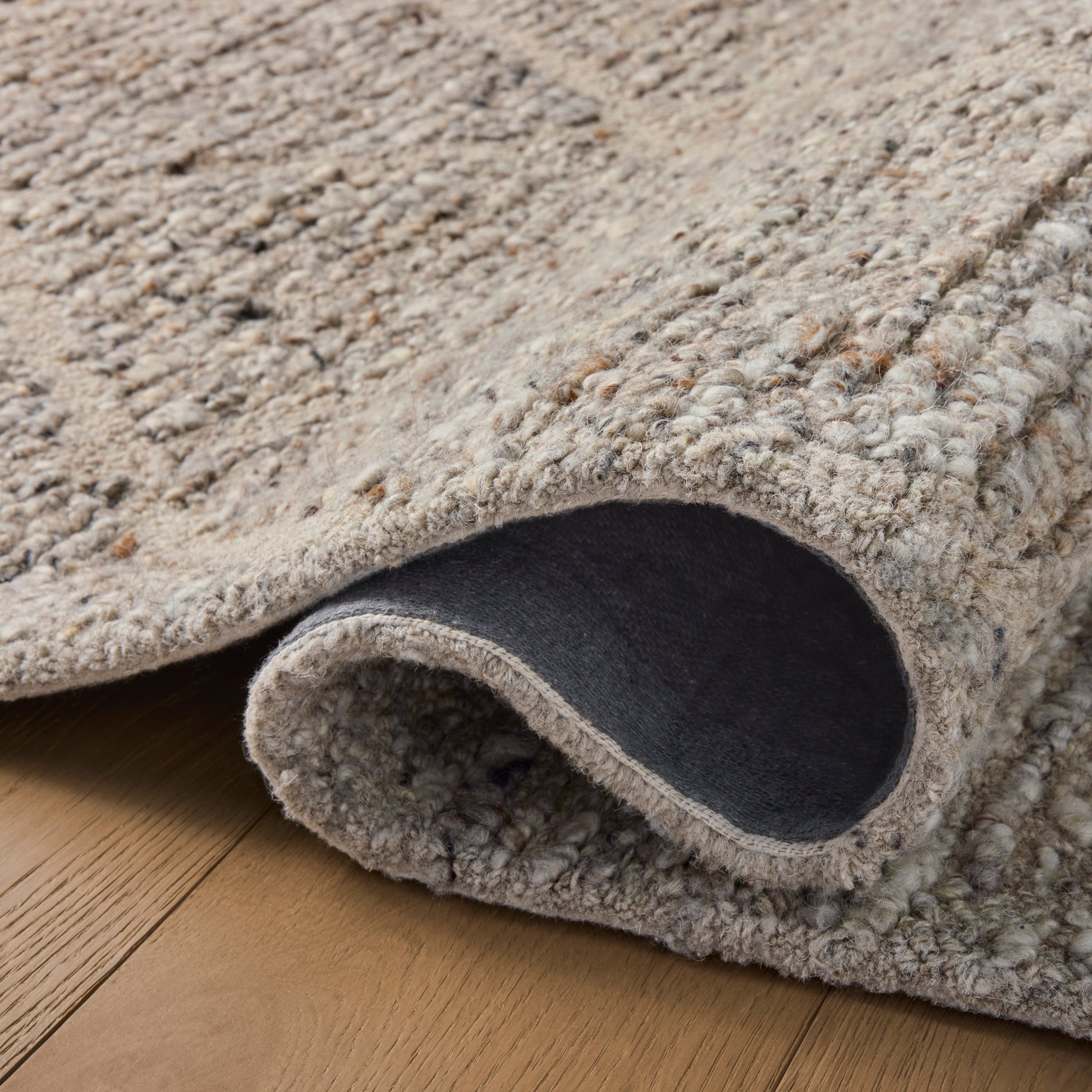 Jones Pebble Rug close up of rolled rug