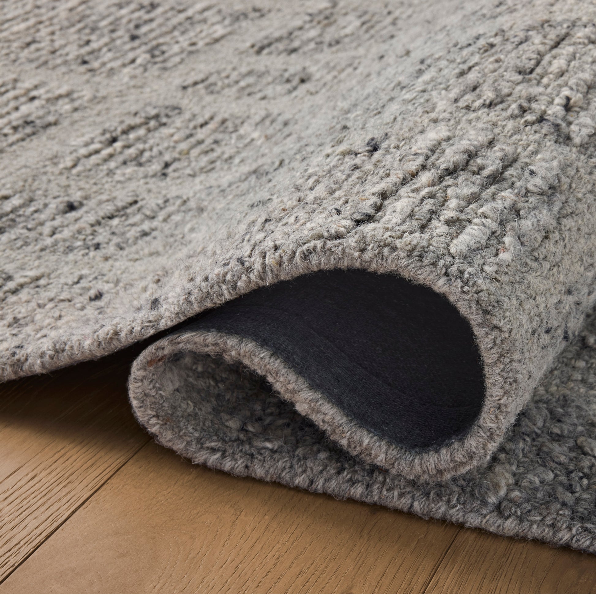 Jones Slate Rug close up of rolled rug