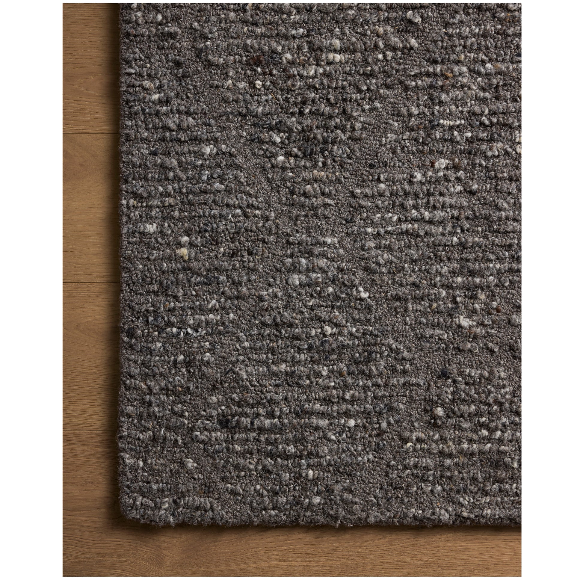 Jones Granite Rug close up of corner of rug on wood floor