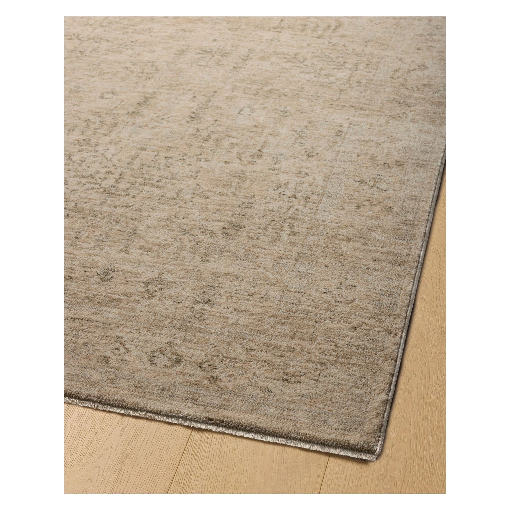 Junie Oatmeal Smoke Rug corner shown from a certain viewing angle