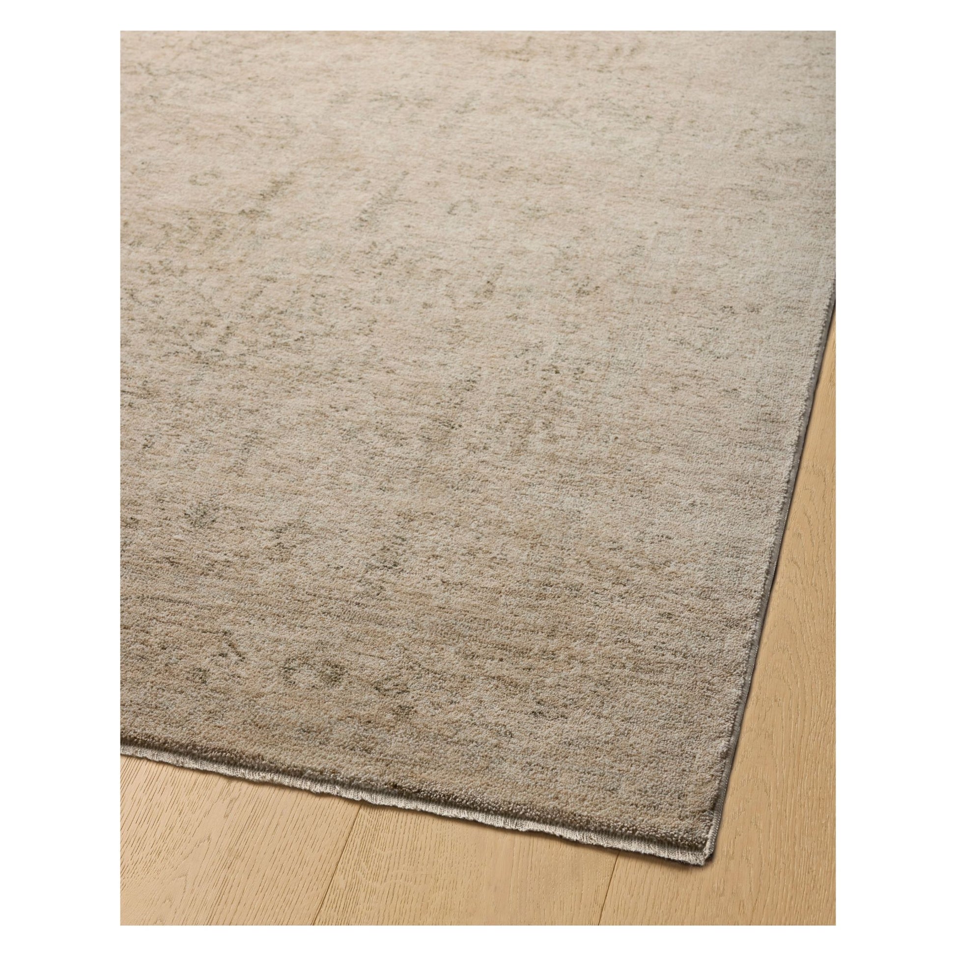 Junie Oatmeal Smoke Rug corner shown from a certain viewing angle