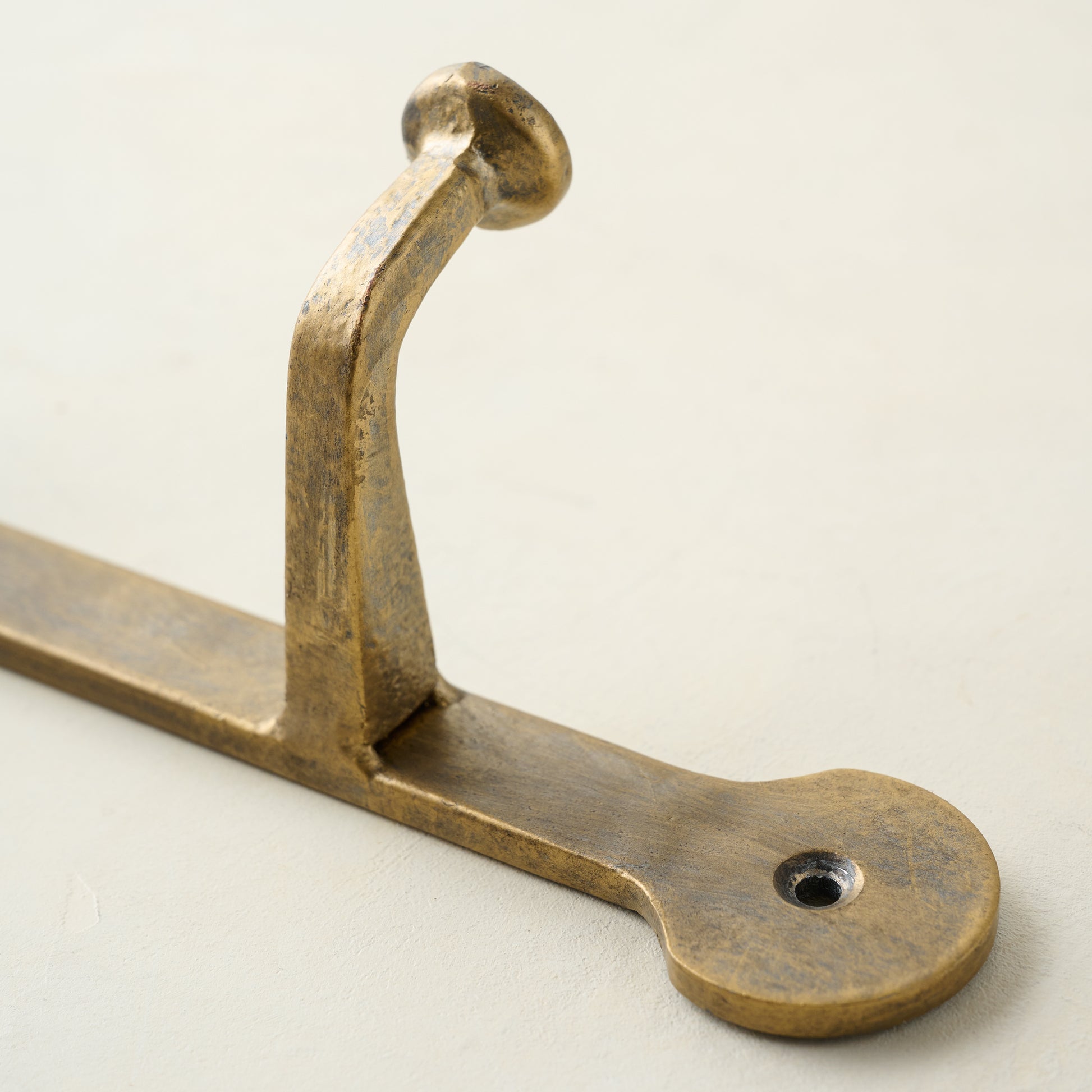 Hammered Iron Wall Hooks close up of hook and hanging screw hole
