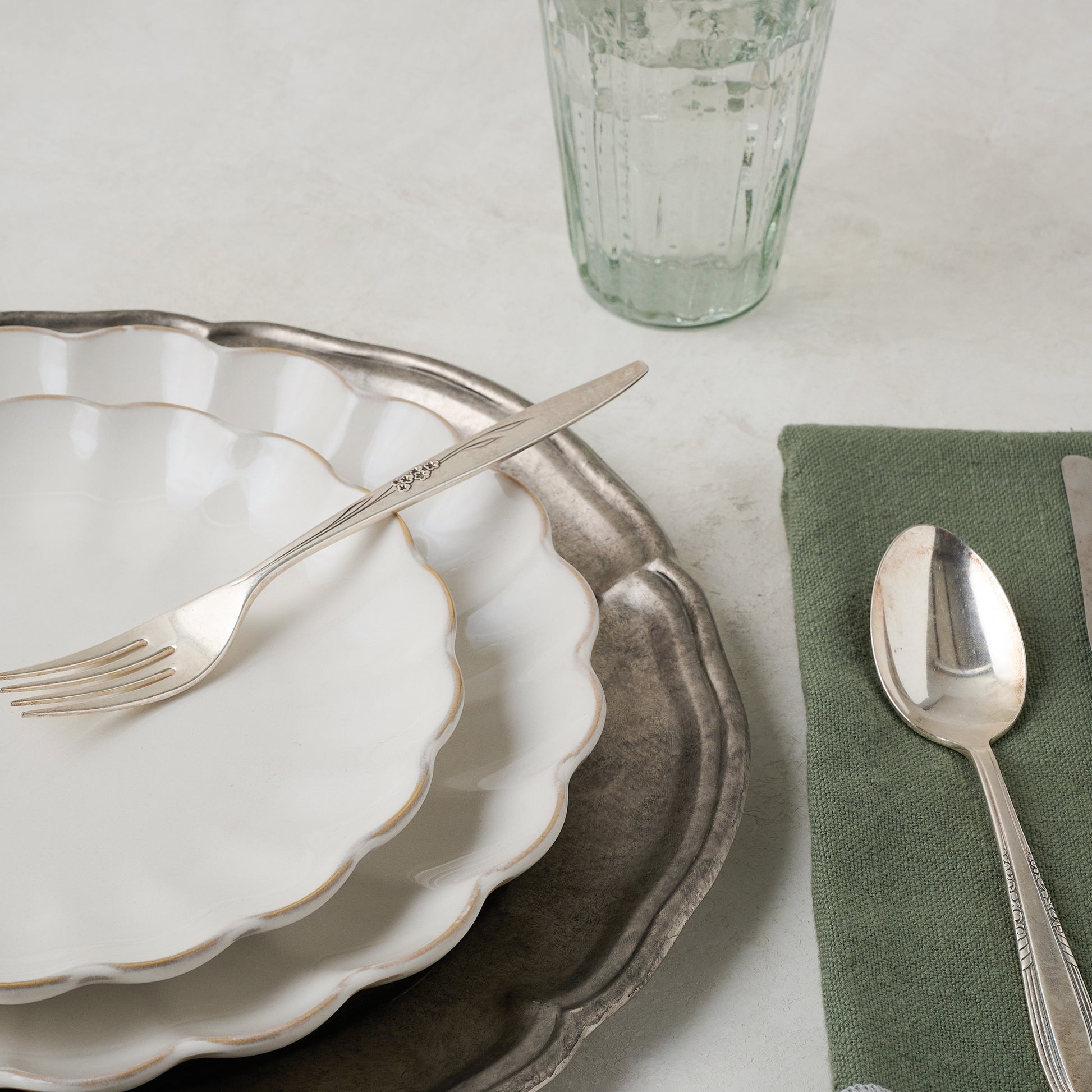 Vintage-Inspired Pewter Charger shown up close with place setting