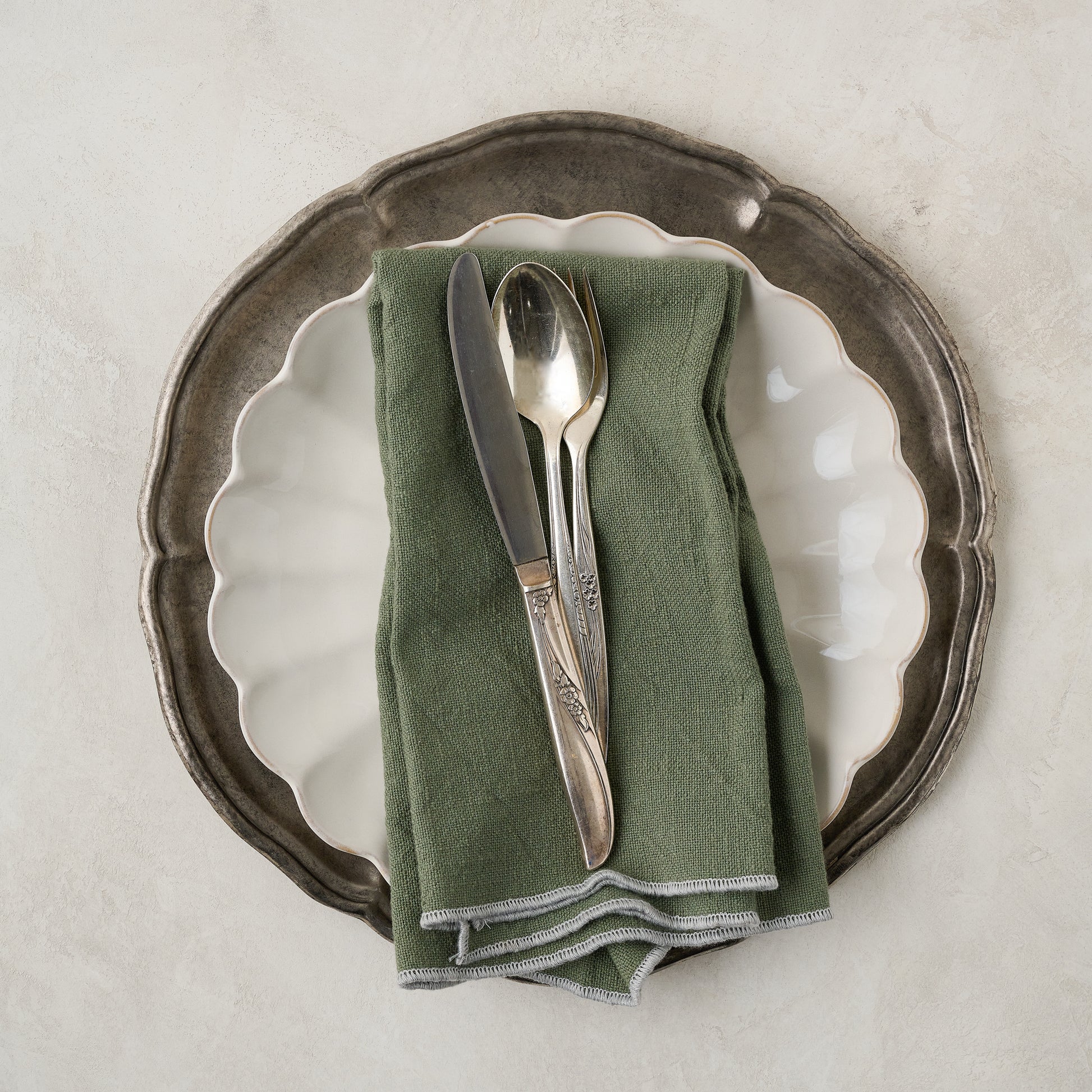 Vintage-Inspired Pewter Charger shown with place setting