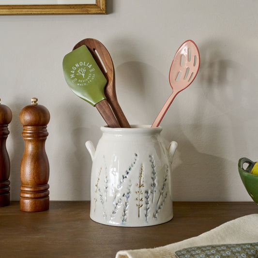 Pressed Floral Utensil Crock shown on countertop with utensils
