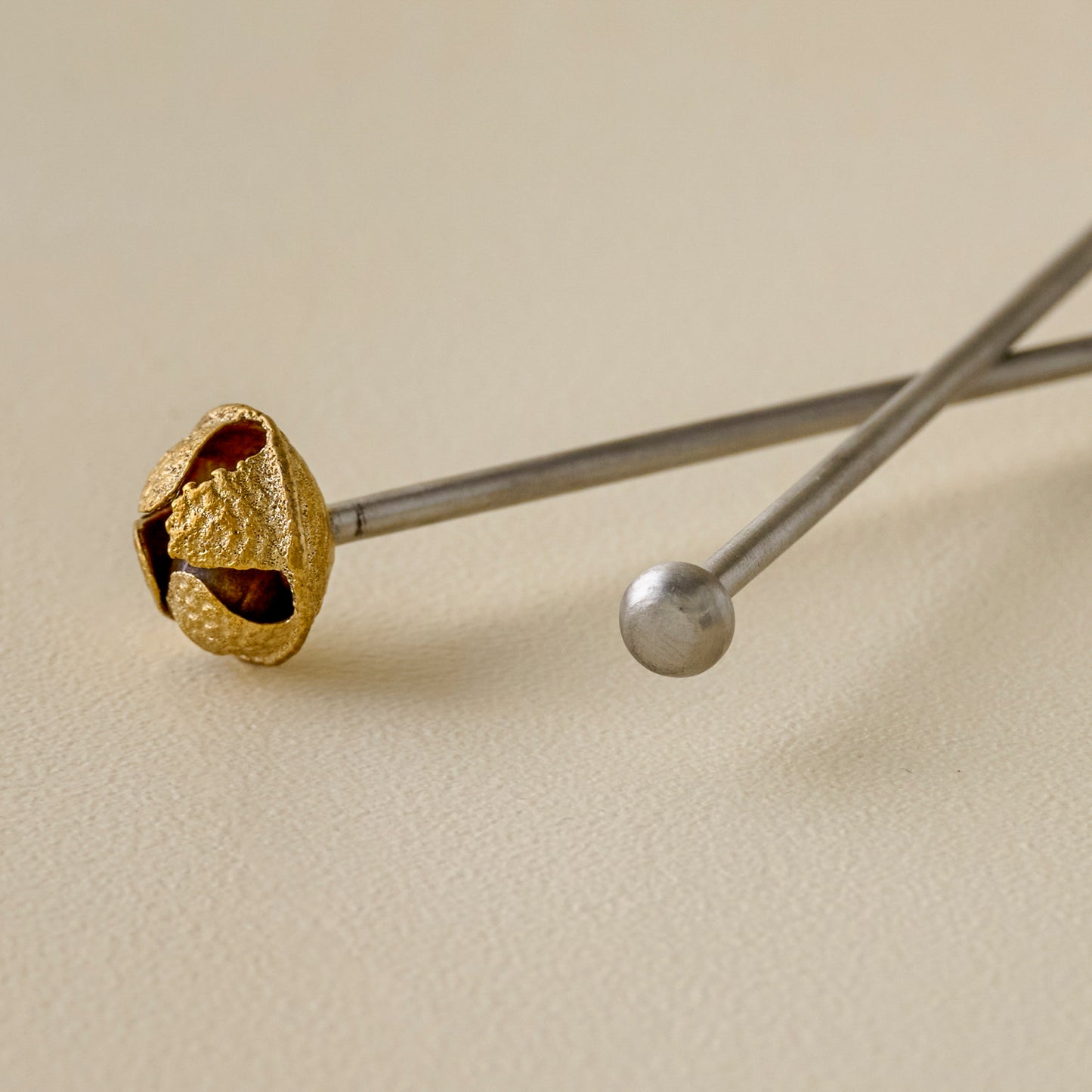 Brass Jingle Bell Cocktail Stirrers up close