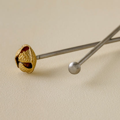 Brass Jingle Bell Cocktail Stirrers up close