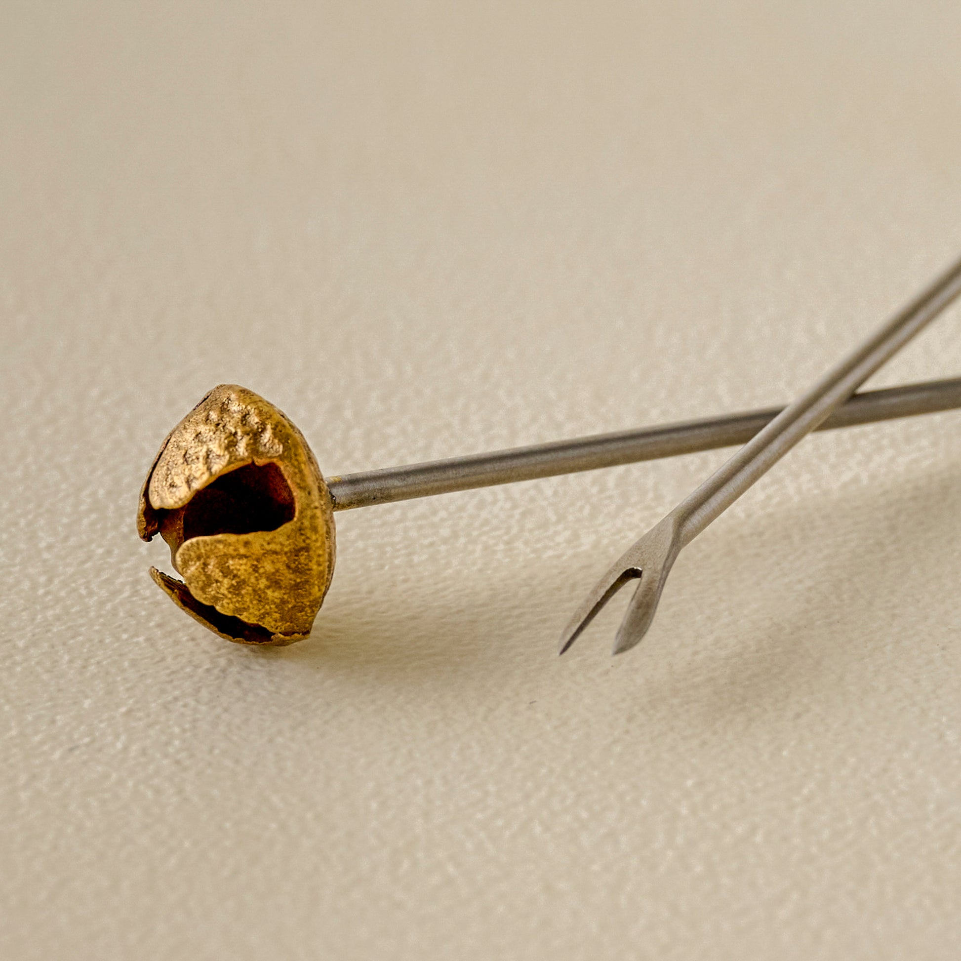 Brass Jingle Bell Cocktail Picks up close