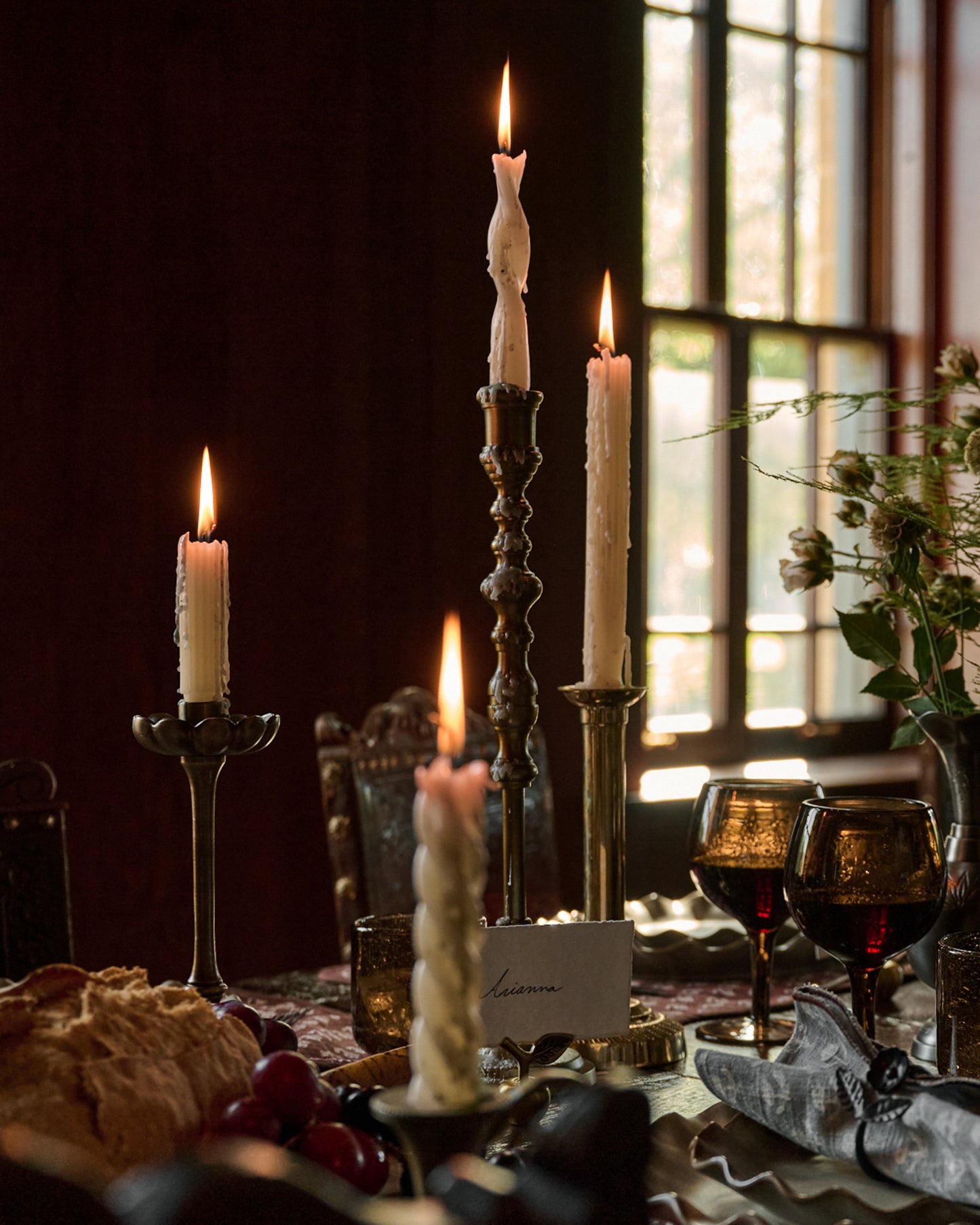 Assorted Drippy Taper Candle - Cream lit up on dinner table