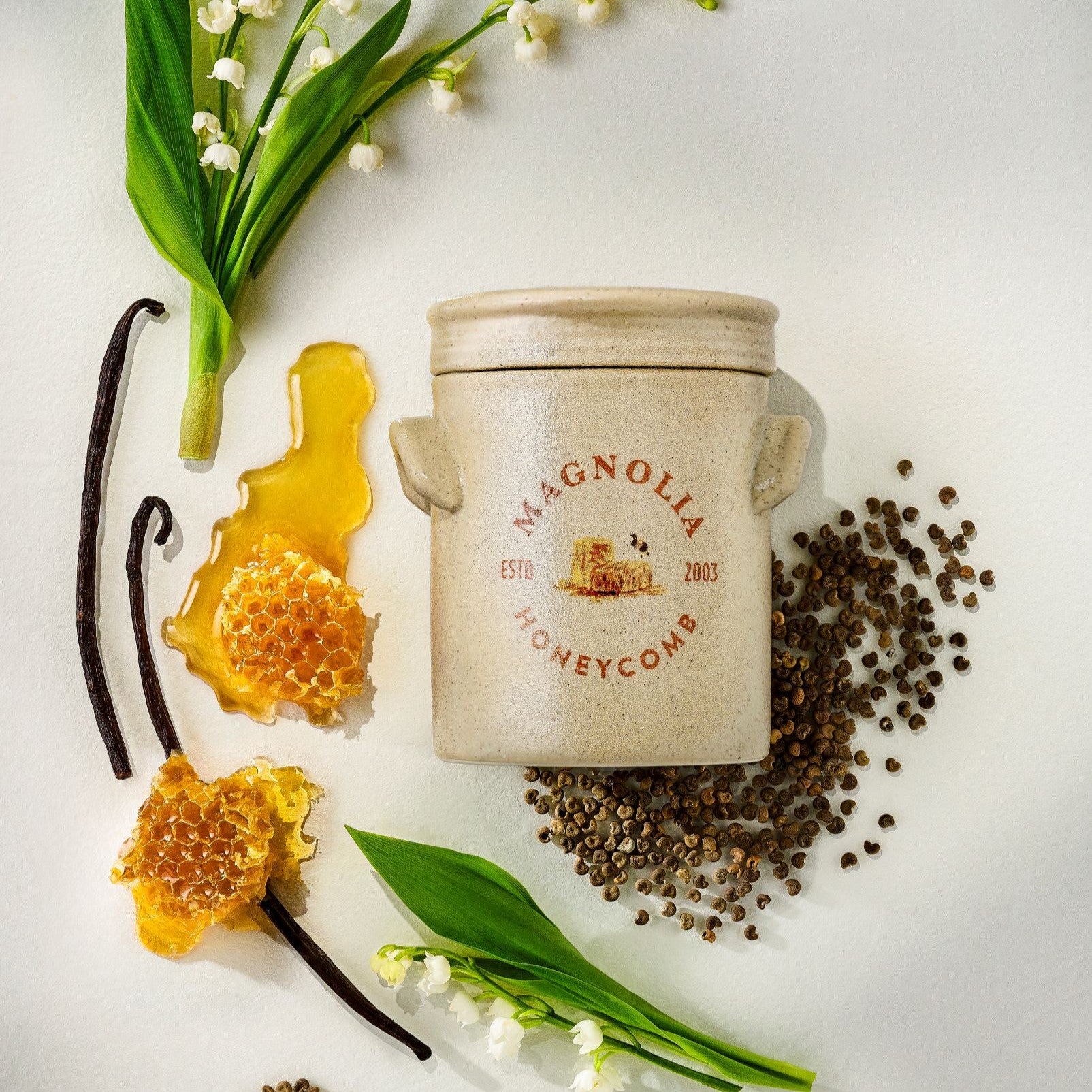 honeycomb candles shows scent notes inlcuding honey vanilla and lily of the valley