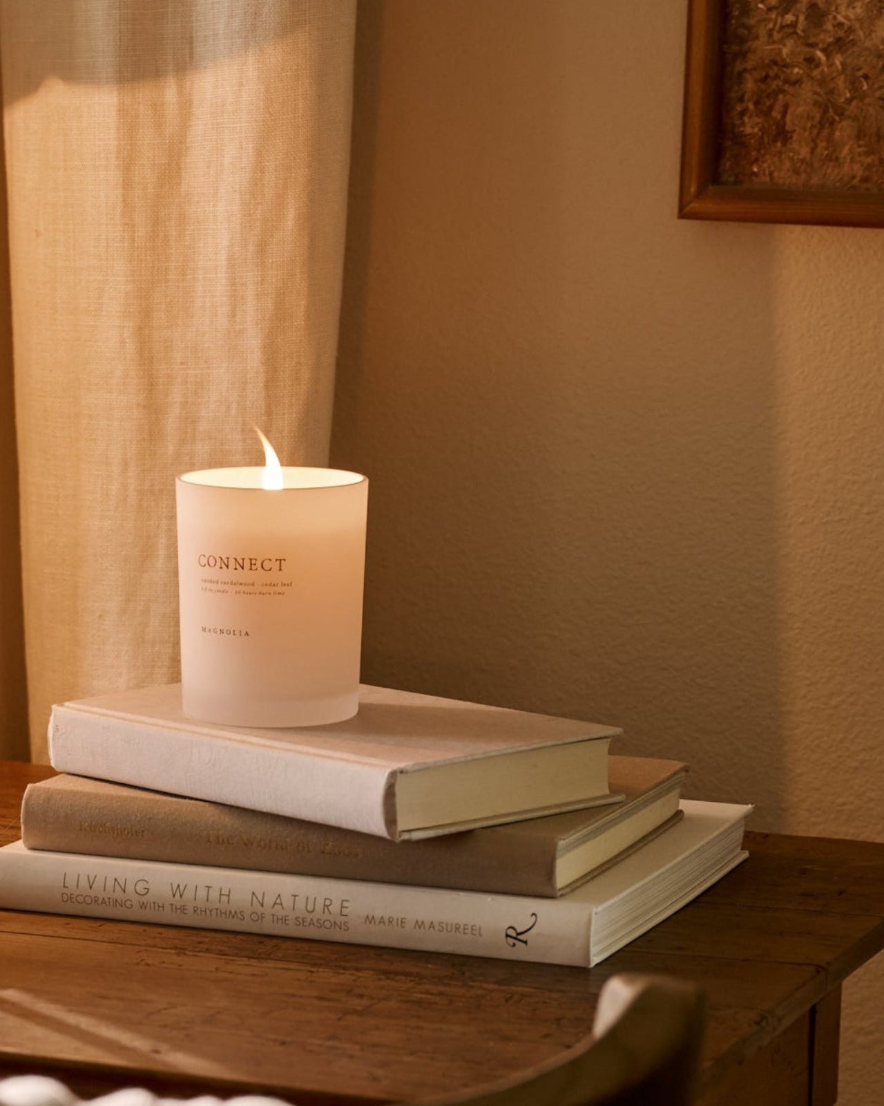 Connect Candle on top of books on desk