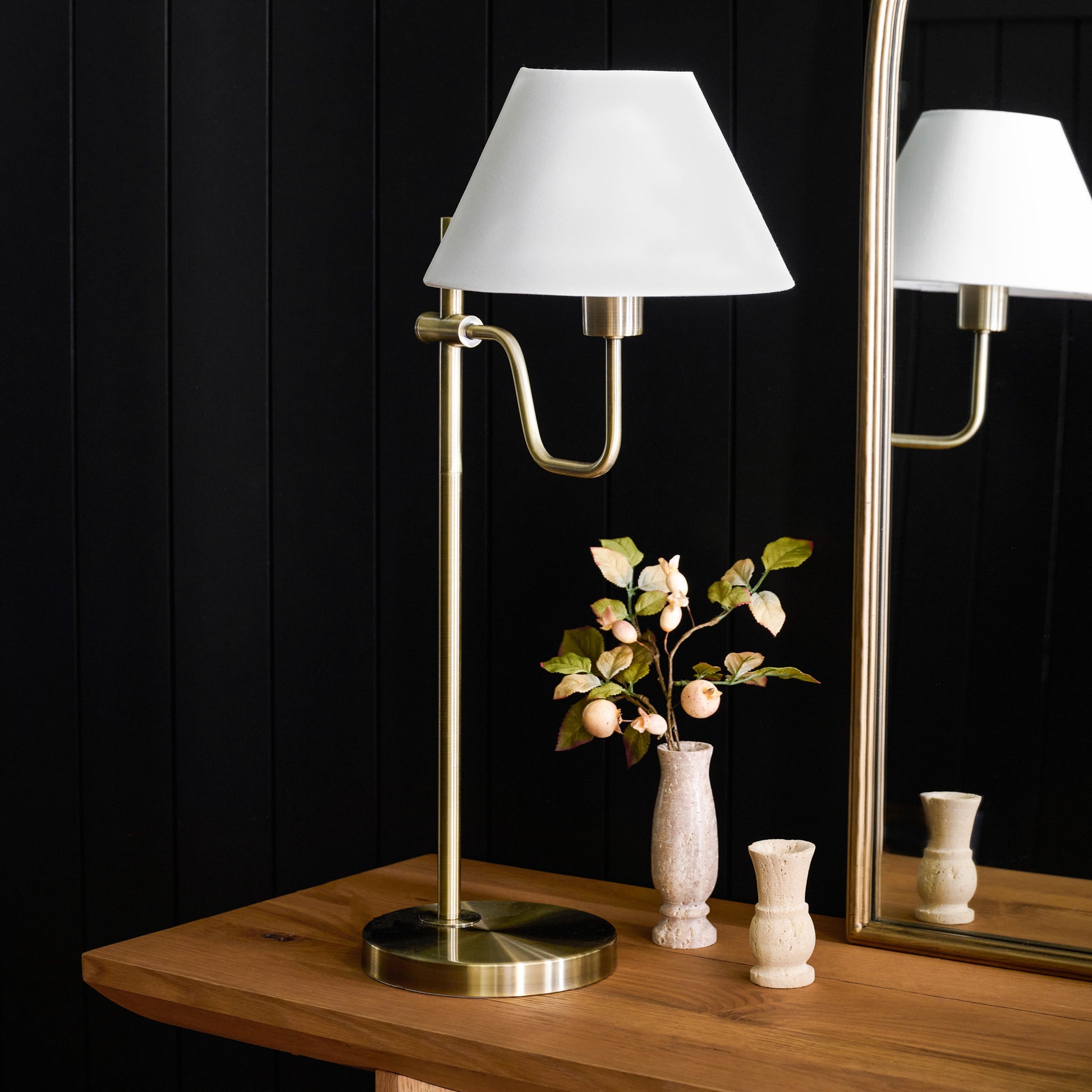 Maren Library Table Lamp on a table in front of a mirror
