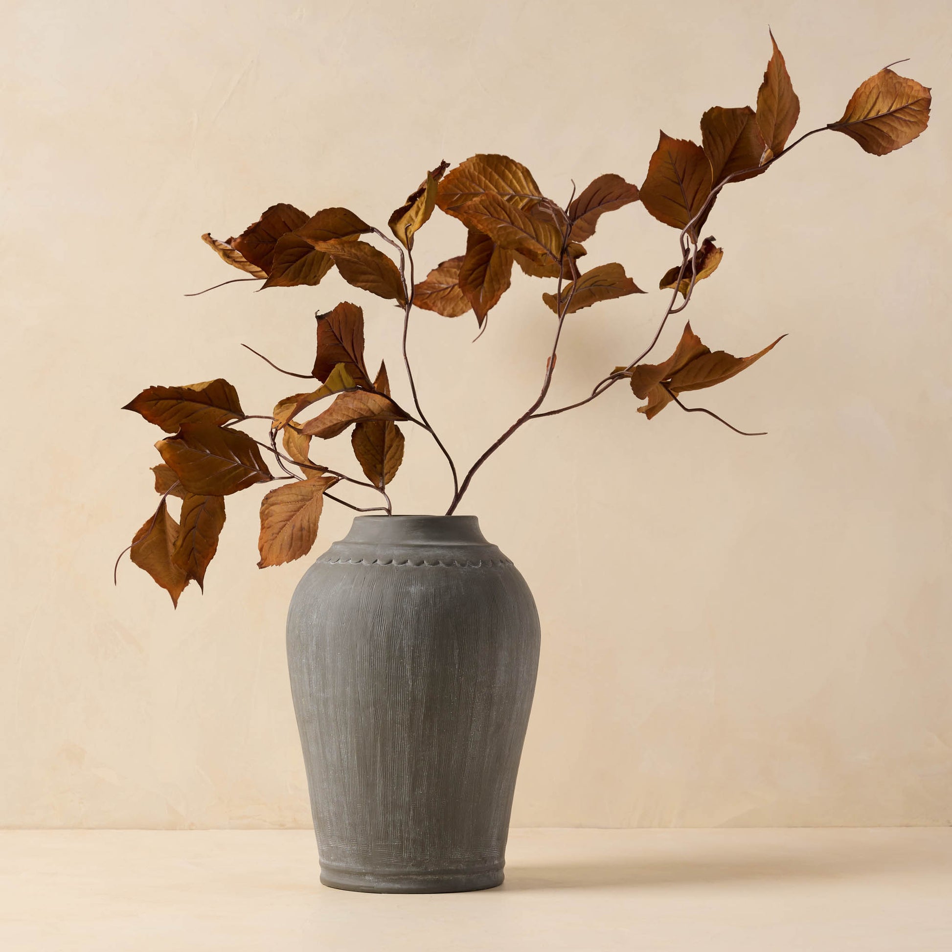 Magnolia Leaf Spray in black vase