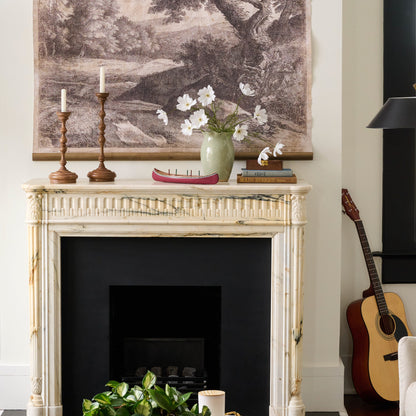 Large Nancy Green Scalloped Ceramic Vase on a fireplace mantle with flowers in it