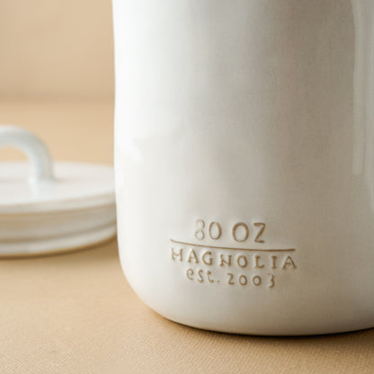 Mia Ceramic Canister close up of magnolia logo