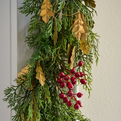 Gilded Leaf Garland wrapped around evergreen garland