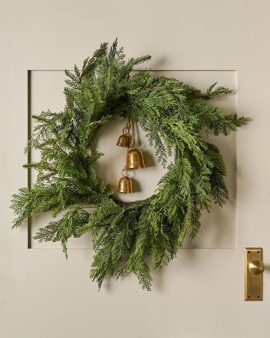 Real Touch Cedar Mix Wreath shown hung on door with bells