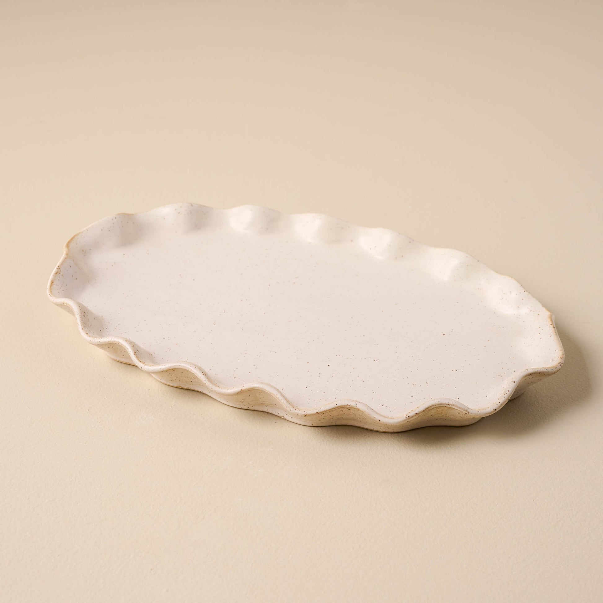 large sized ivory Ceramic tray with ruffled edge