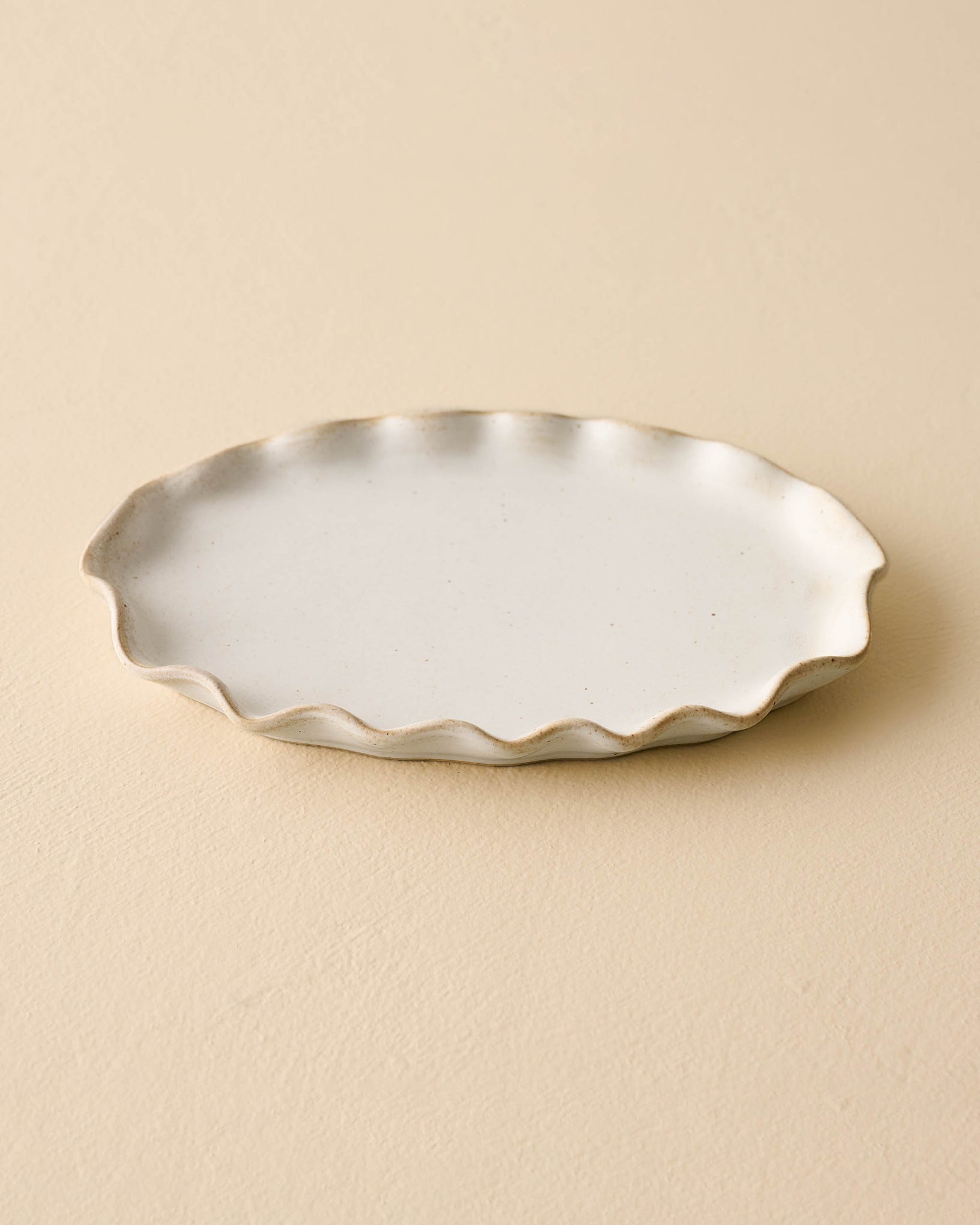 small sized ivory Ceramic tray with ruffled edge