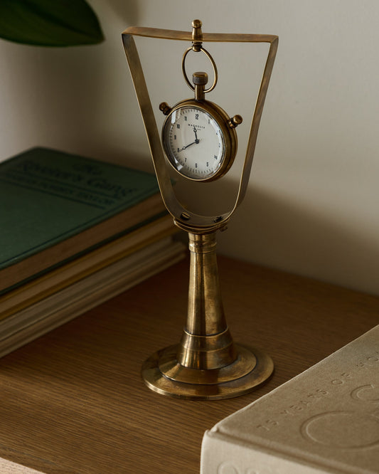 Antique Inspired Hanging Table Clock on a shelf
