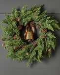 Real Touch Maeve Pine Wreath shown hung on door with bell