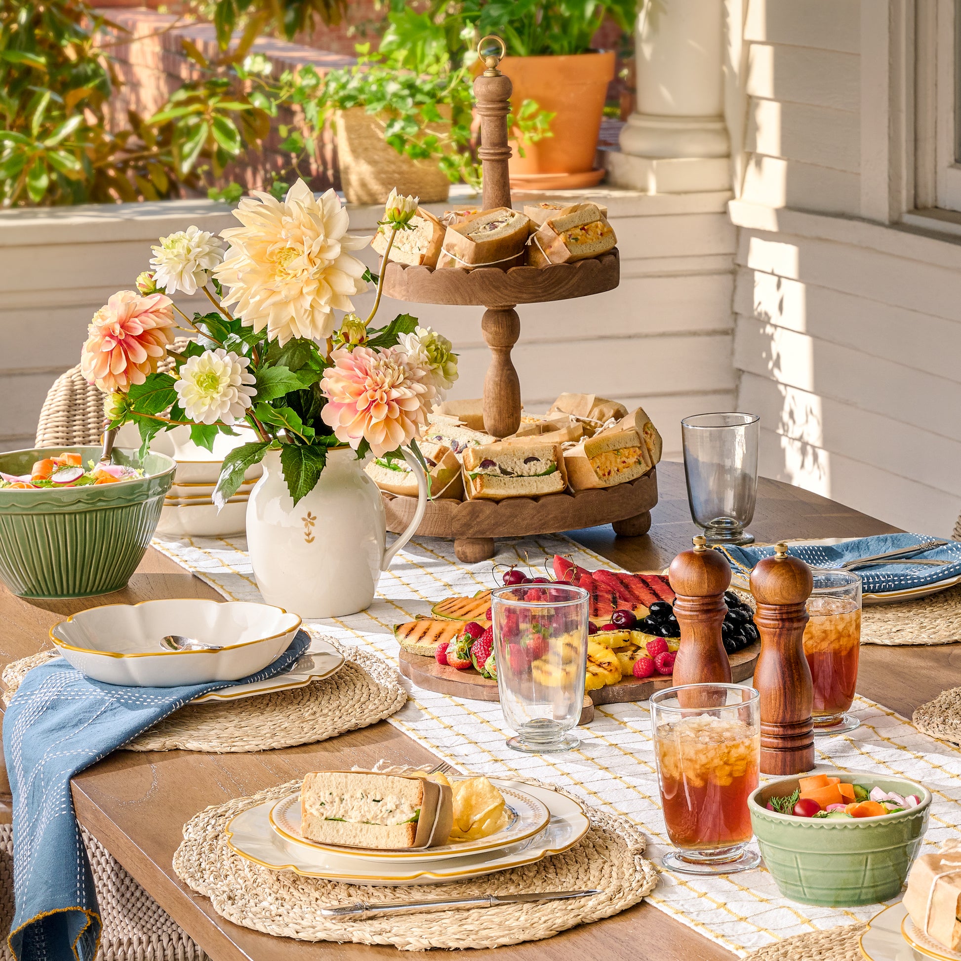 Antiqued Wood Tiered Riser on a table with sandwiches on each tier