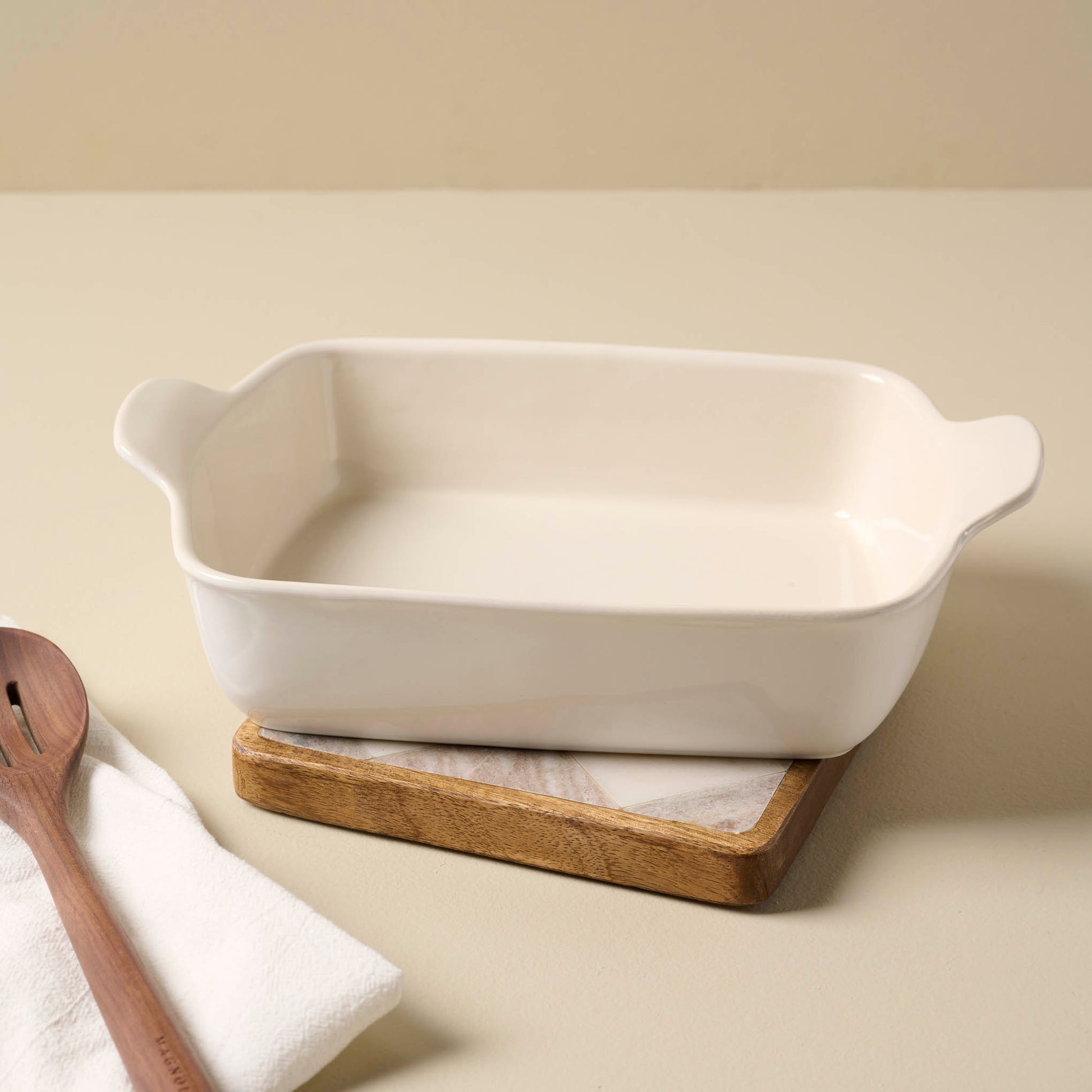 Everett Checkered Marble Trivet with a baking dish on top