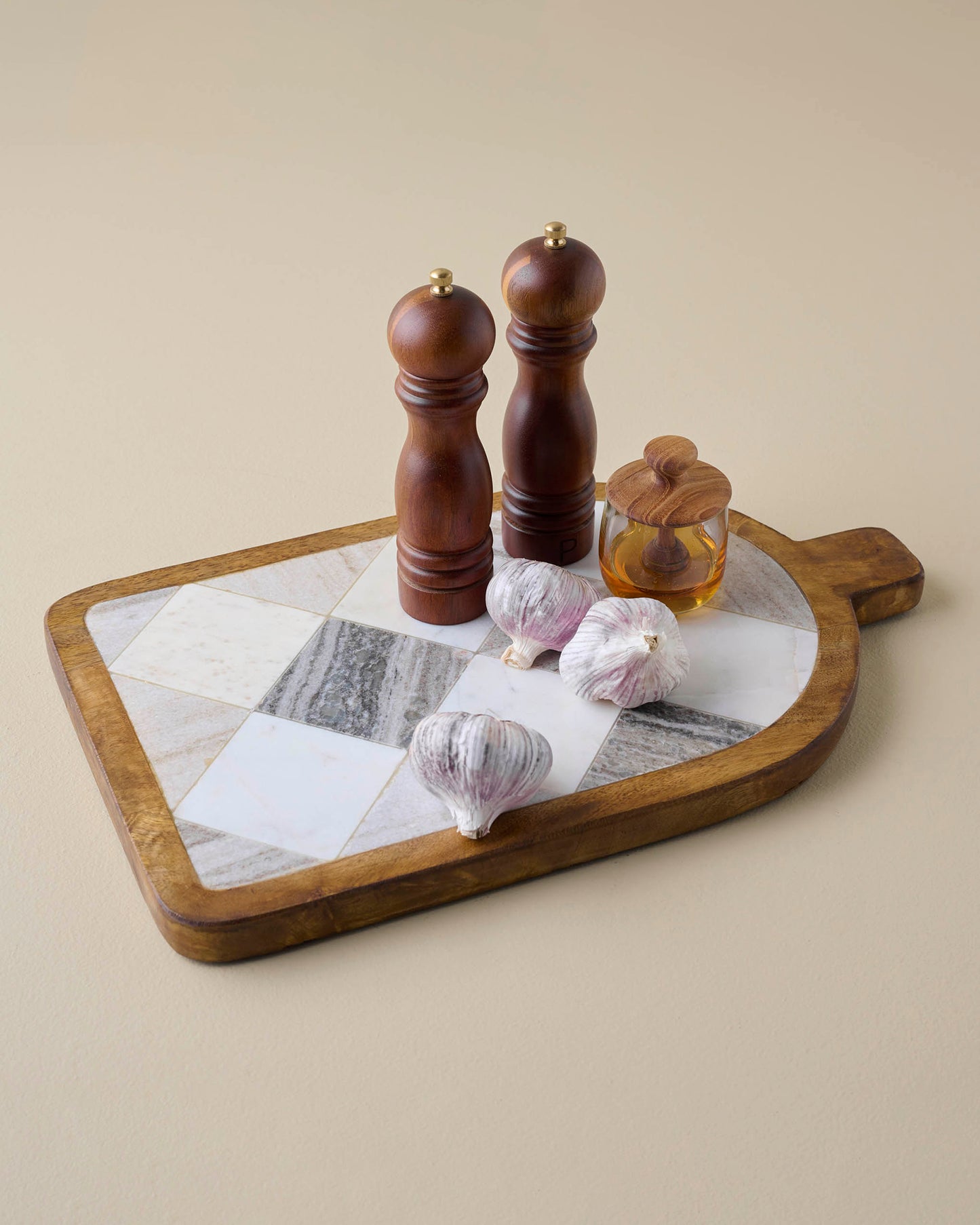 Everett Checkered Marble Serving Board with other kitchen items for scale