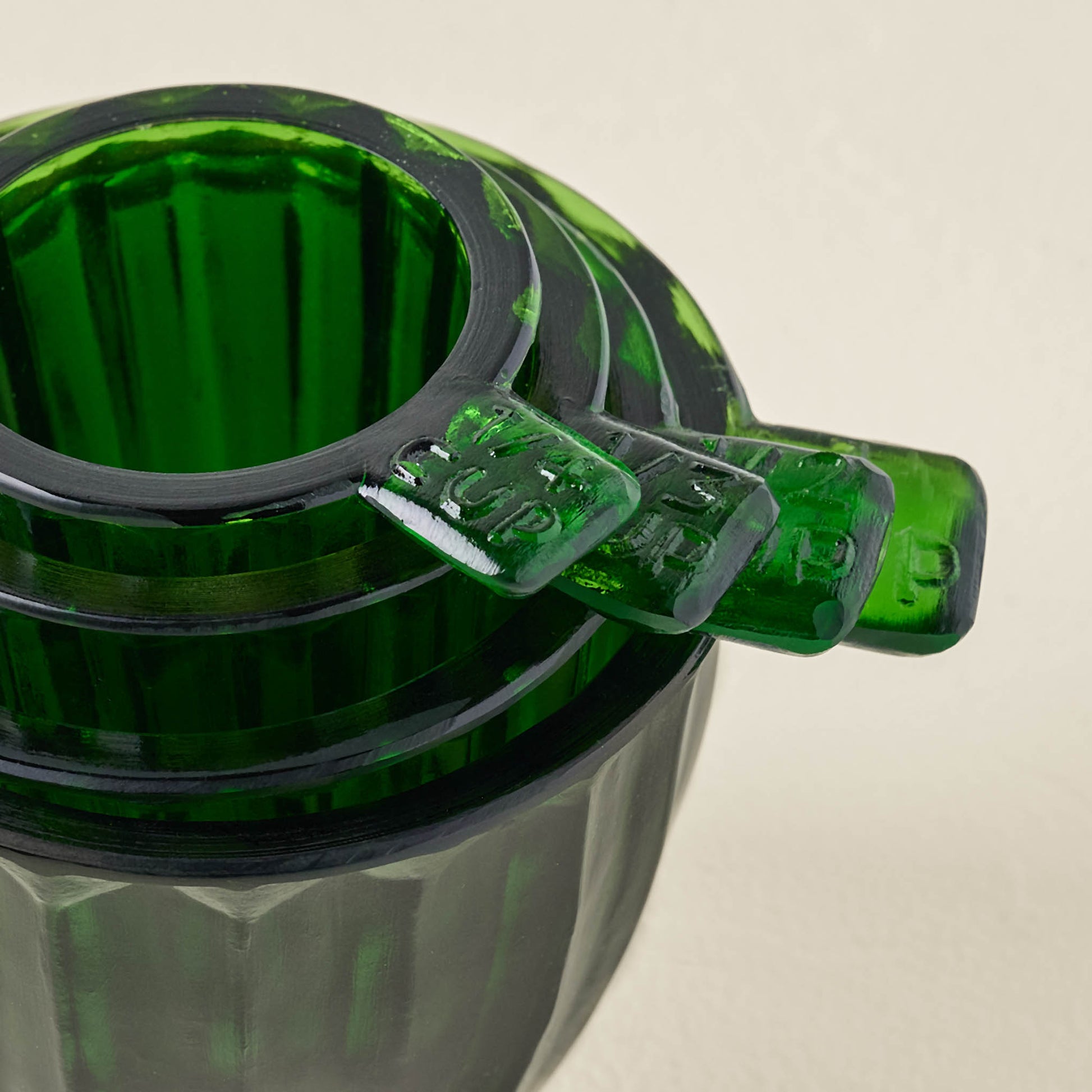Green Glass Measuring Cup Set stacked inside one another