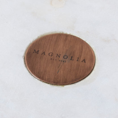 Marble and Copper Cake Stand close up of magnolia logo on center of marble